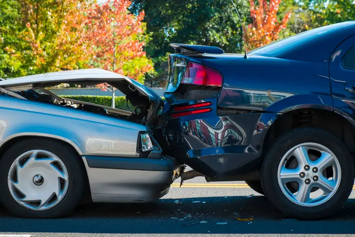 Two damaged cars after a car accident on the road