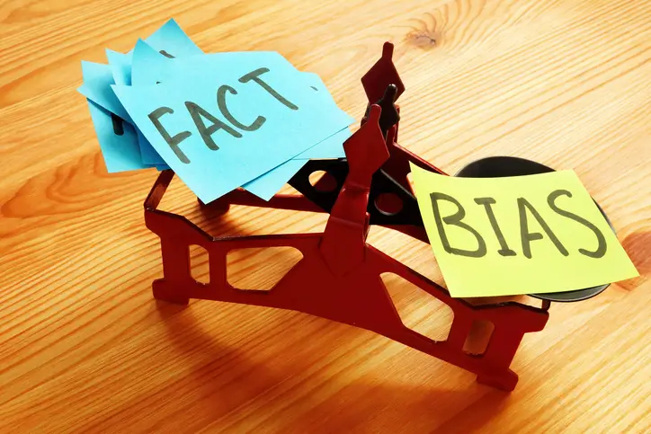 Scale weighing fact against bias, symbolizing the stereotypes and prejudice often faced by motorcyclists in legal cases.